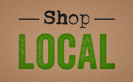 Shop local written on a retro paper background