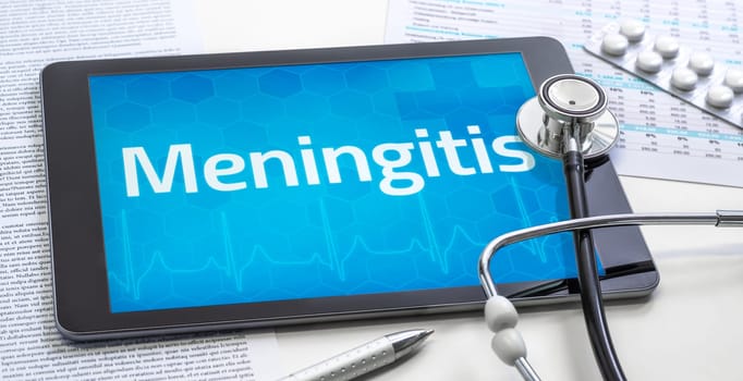 The word Meningitis on the display of a tablet