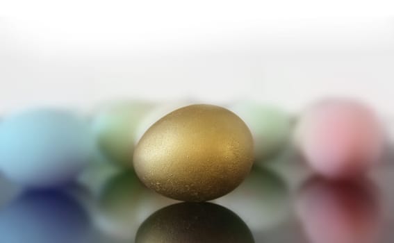 close up of golden and colored easter eggs