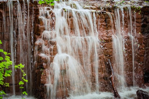 Small waterfall in the city garden