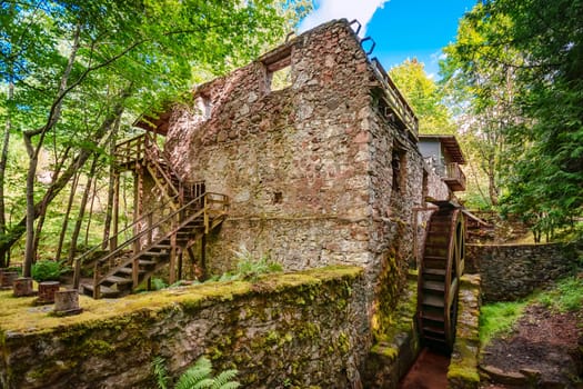 Old ruins of water mill the forest