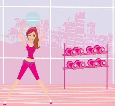 Young smiling woman makes exercise with fitball