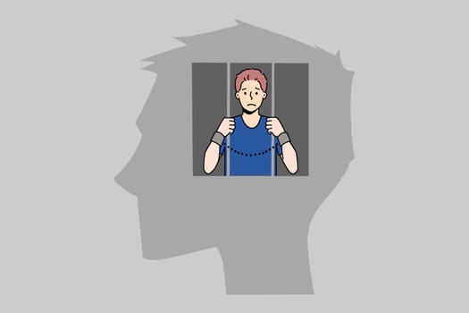 Man in jail inside human head suffer from freedom of thoughts or rights. Unhappy imprisoned male locked in mind have life restrictions and bans. Brain prison. Vector illustration.