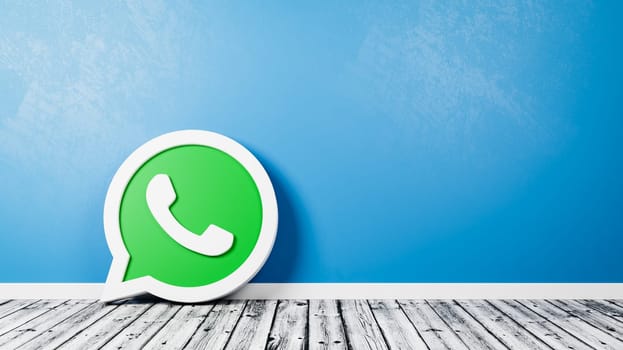 Whatsapp Logo 3D Symbol Shape on Wooden Floor Against Blue Wall with Copy Space 3D Render Illustration