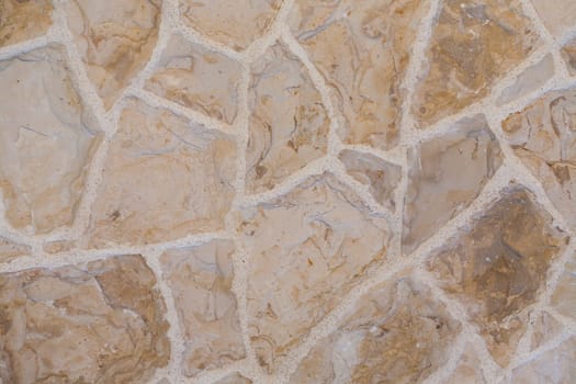 Stone slabs laid on the floor. Shades of brown in full frame.