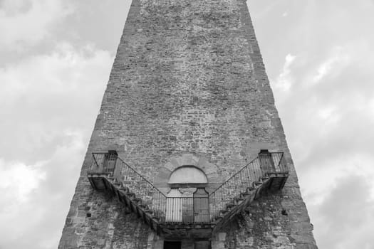 Exterior of antique tower building with Escher architecture style. Simmetry and geometric perspective.