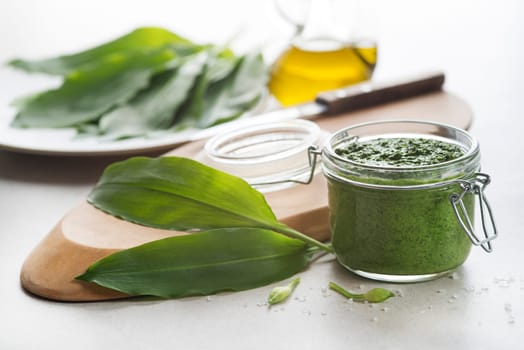 Fresh ramson or wild garlic pesto close up. Healthy spring food concept