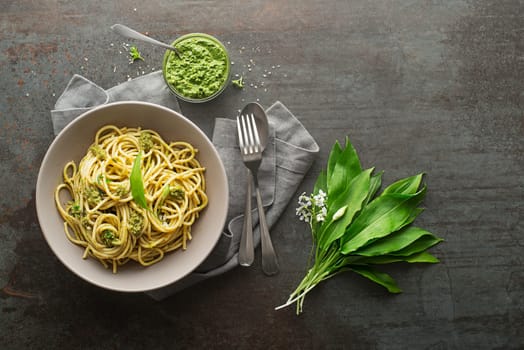Making Fresh pasta with ramson or wild garlic pesto. Healthy spring food concept