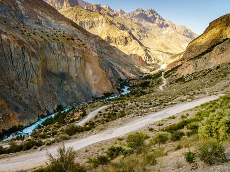 Scenic mountain road to Iskanderkul - an alpine lake in the mountains of Tajikistan