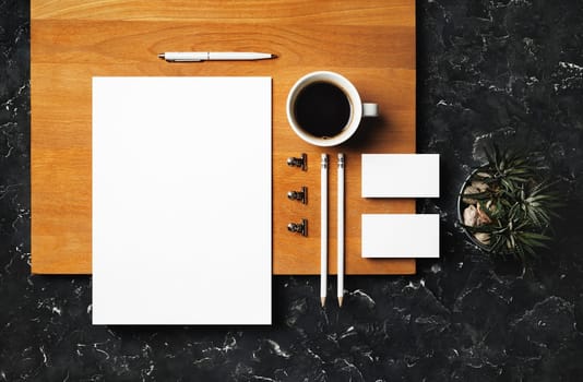 Blank branding stationery set on wooden board background. Template for branding identity. Flat lay.