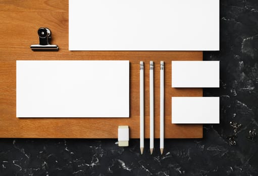 Corporate identity mockup. Blank stationery set on wooden board background. Responsive design template. Flat lay.