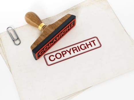 Copyright stamp standing on documents. 3D illustration.