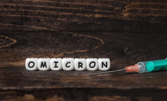 Corona virus Covid-19 vaccine text on wooden background