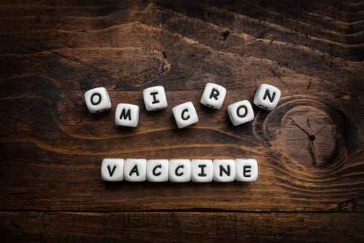 Corona virus Covid-19 vaccine text on wooden background