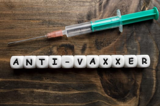 Corona virus Covid-19 vaccine text on wooden background