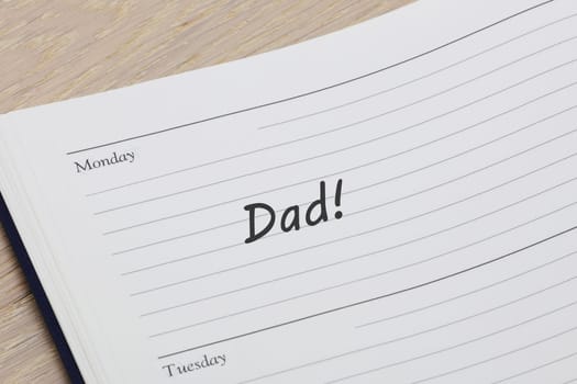 A Dad reminder note in a diary page