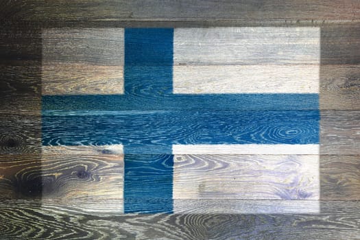 A Finland flag on rustic old wood surface background
