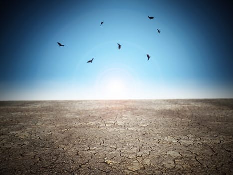 Cracked desert soil against blue sky. 3D illustration.