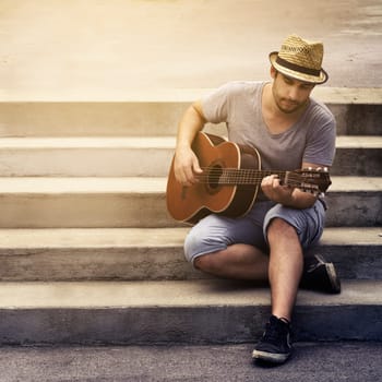 Man playing guitar on the street