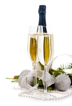 Champagne and christmas decoration over white background