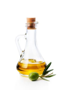 Olive oil bottle and olive fruit isolated over white background