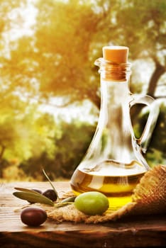 Olive oil bottle and olive fruit