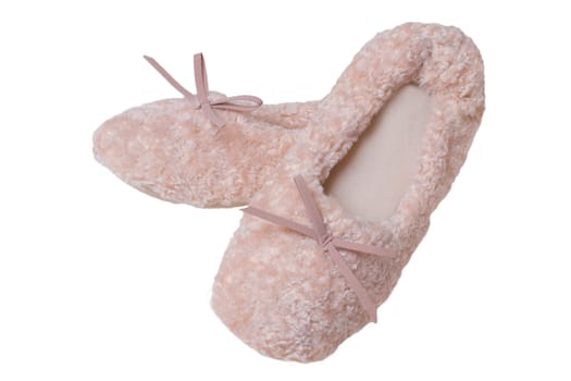 Slippers isolated. Close-up of a pair of female pink warm and soft cosy terry slippers isolated on white background.  Womans shoes.