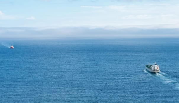 Passing freighters in the sea
