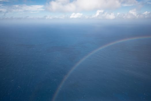 Rainbow crossing a dreamy seascape in Kauai