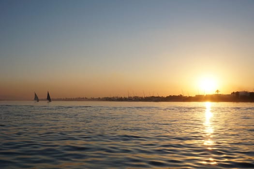 Beautiful sunset over the Nile in Luxor from a Felucca, Egypt