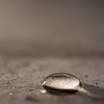 A single drop of water on a granite surface
