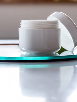 Empty cream tin,open