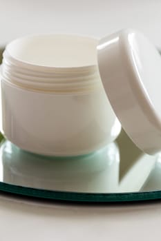 Empty cream tin,open