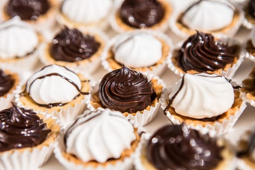 white and black meringue cookies. Creative background