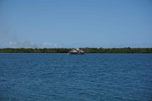 Floating bar with Manda Island in the background, Lamu Island, Kenya