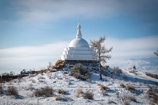Ogoy Island, Baikal Lake, Russia- White Buddhist stupa and the baikal lake