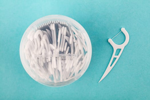 Box with dental Floss over light blue background