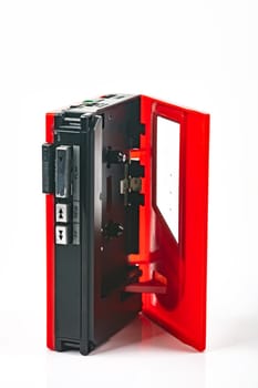 Beautiful red vintage audio cassette player over white background