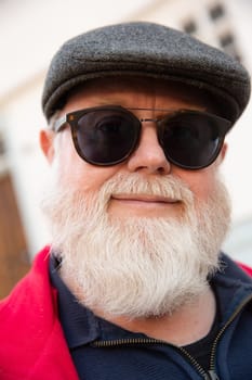 Headshot from friendly male man with big white beard