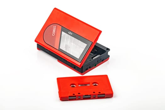 Beautiful red vintage audio cassette player over white background