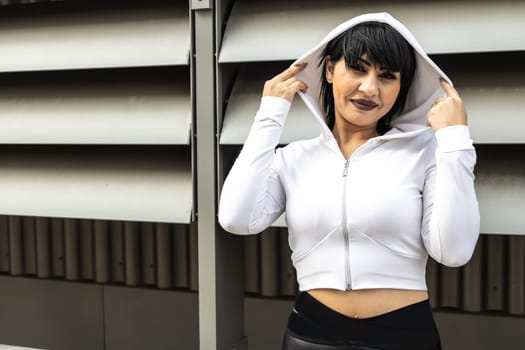 Young cute black hair woman posing with stylish Hoodie