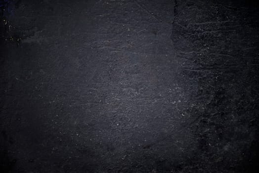 Grungy black textured metal background