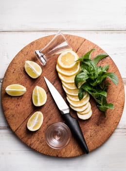 Cocktail ingredients on wooden board.