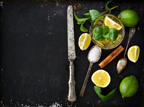 Mojito ingredients on black rustick background