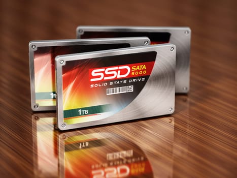 Generic SSDs standing on wooden table. 3D illustration.