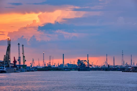 Port of Antwerp with harbor cranes in dusk. Antwerp, Belgium