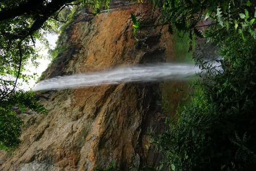 One of the Sipi Falls at Mount Elgon National Park in between lush vegetation, eastern Uganda