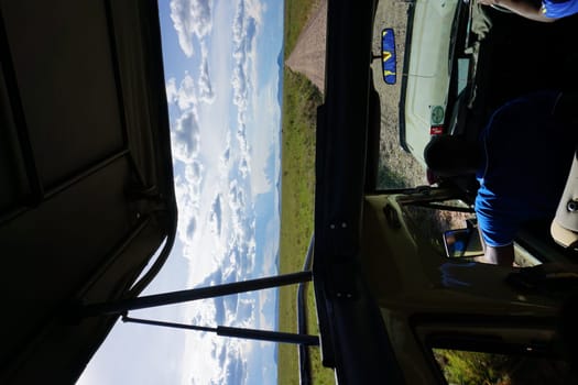 Game drive in the Serengeti with the roof of our 4x4 open, Tanzania 2021