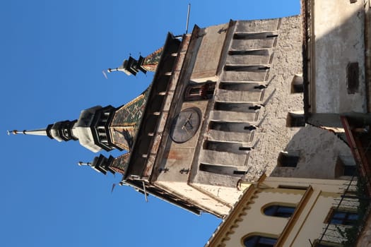 View onto Sighisoaras famous Clock Tower from outside of the citadel, Romania 2021