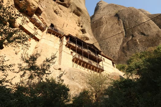 View onto the fascinating Monastery of St. Anthony in Meteora, built into a cave, Greece 2021